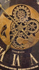 Close-up of an intricate clock mechanism featuring gears and brass detailing.