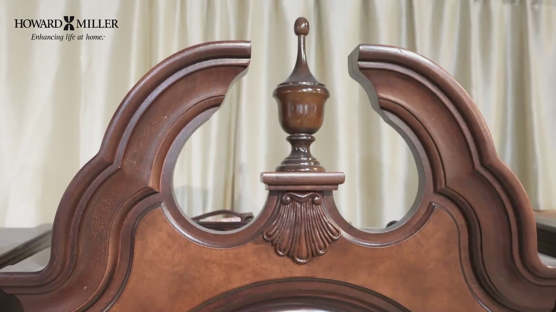 Close-up of a decorative wooden headboard with intricate design elements.