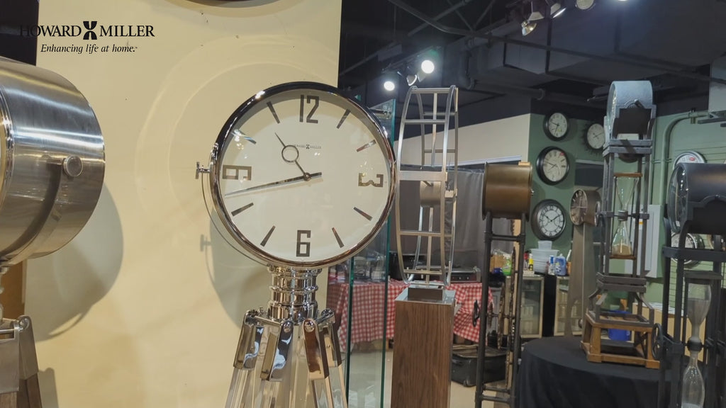 Close-up of a large wall clock in a display featuring various clocks and timepieces.
