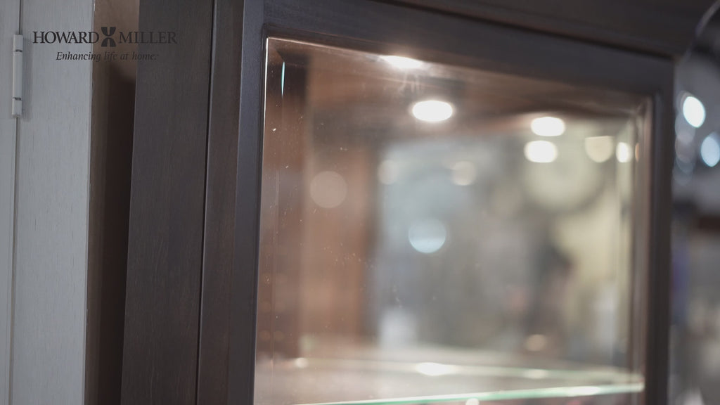 Close-up view of a glass display cabinet with soft lighting.