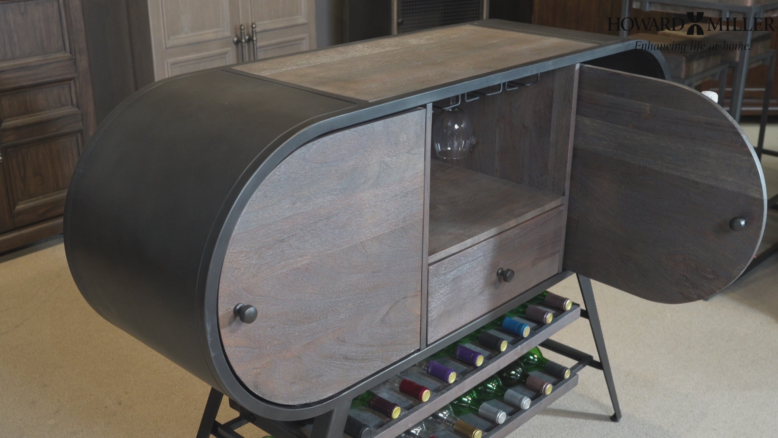 Modern wooden cabinet with curved design and open doors, revealing storage space and wine bottles