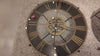 A large decorative wall clock with Roman numerals and a vintage design, showing the gears of the clock face moving.