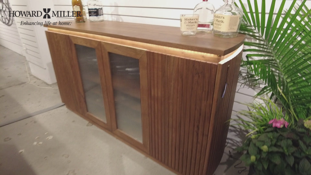 Wooden sideboard with glass doors and a polished countertop