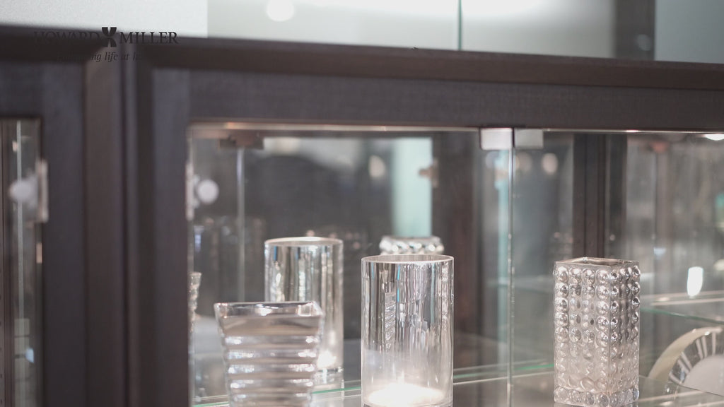 Glass display case showcasing various decorative glass items