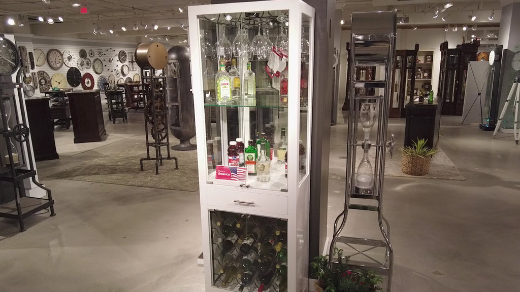 Display cabinet with various bottles and products in a spacious showroom.