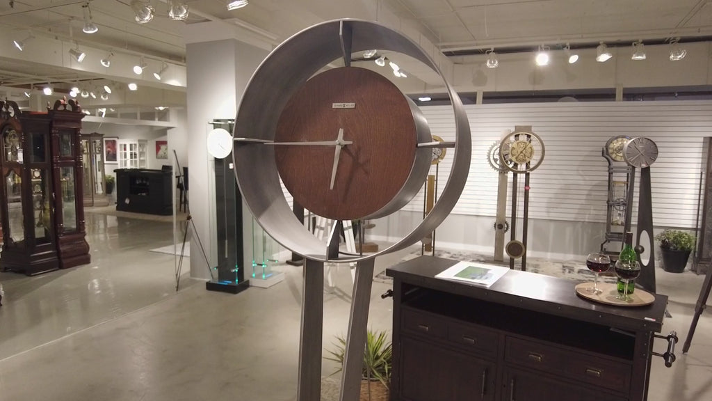 Modern wall clock displayed in an art gallery setting