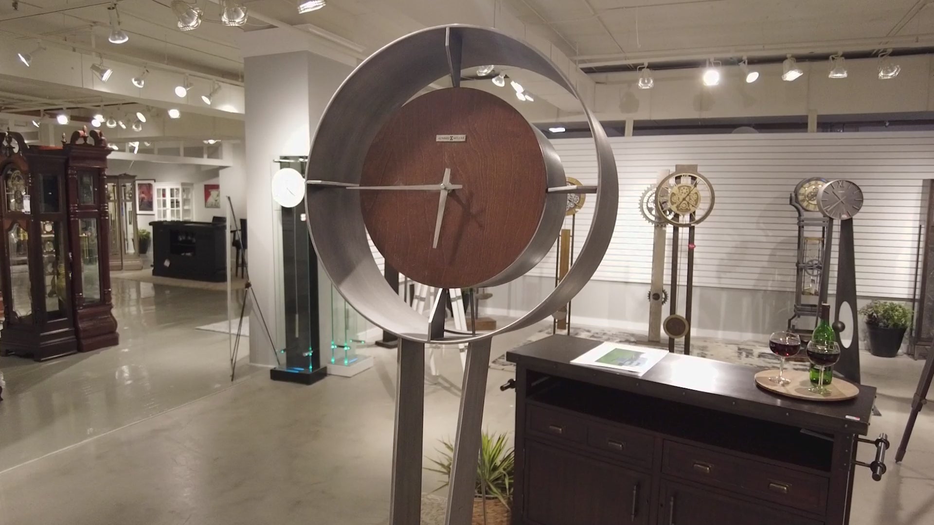 Modern wall clock displayed in an art gallery setting