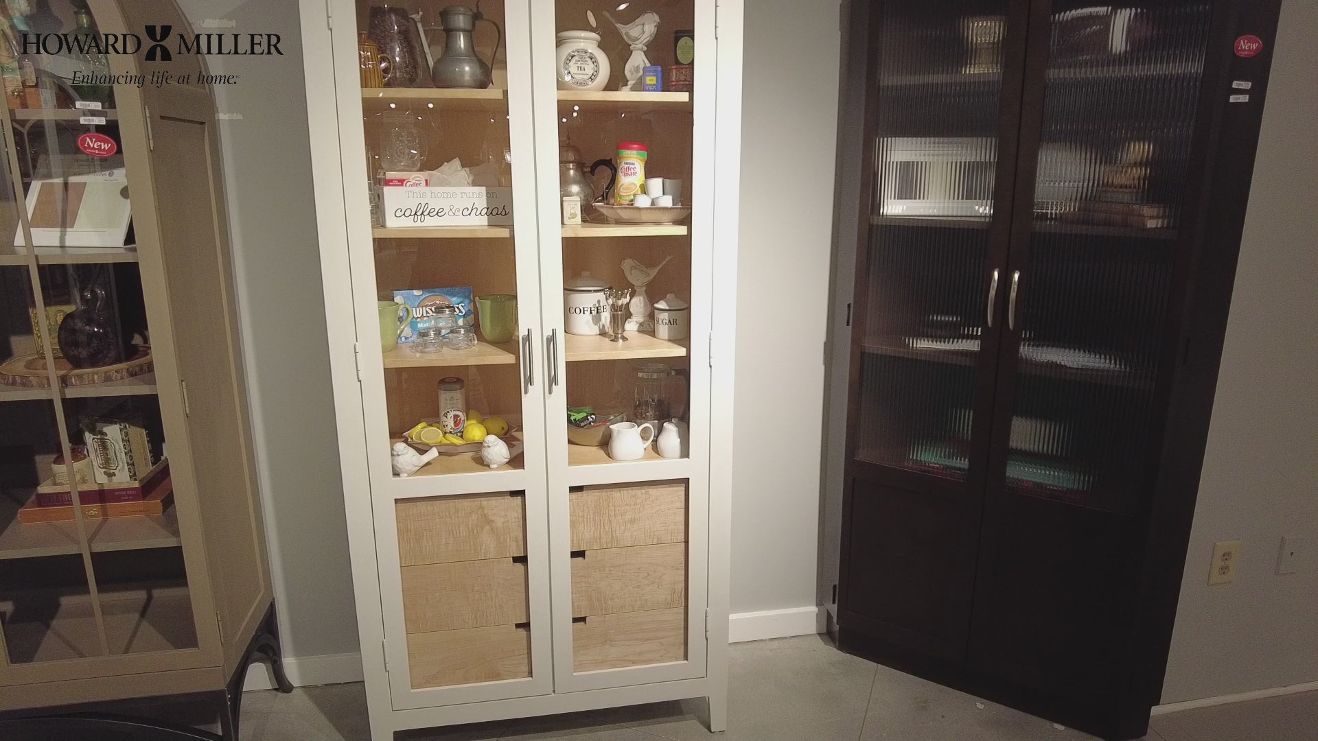 Display cabinets with various decorative items and tableware.