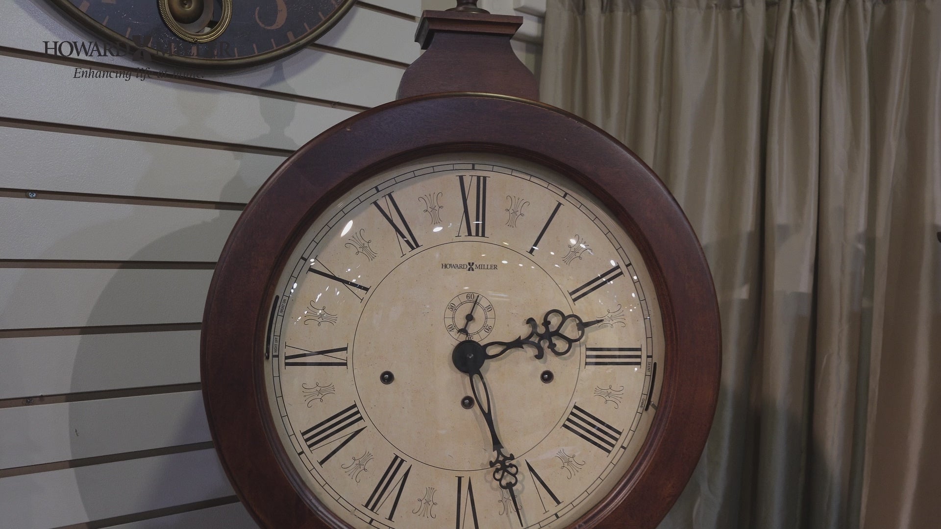 Antique wall clock with Roman numerals and decorative detailing