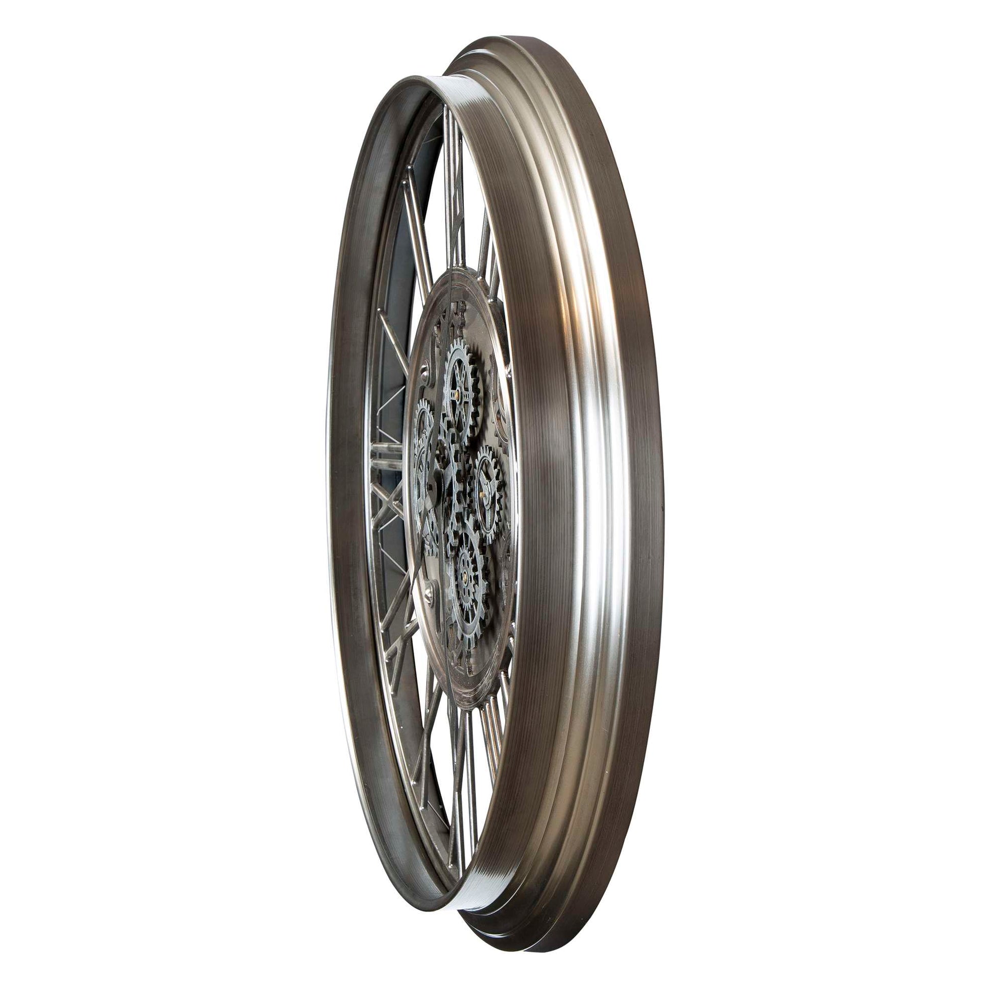 A metallic wheel with a detailed spoke design, viewed from the side.