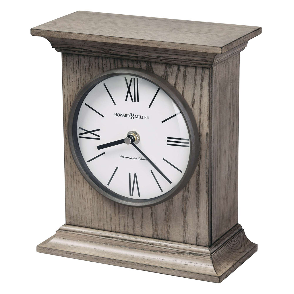 A decorative wooden mantel clock with Roman numerals.