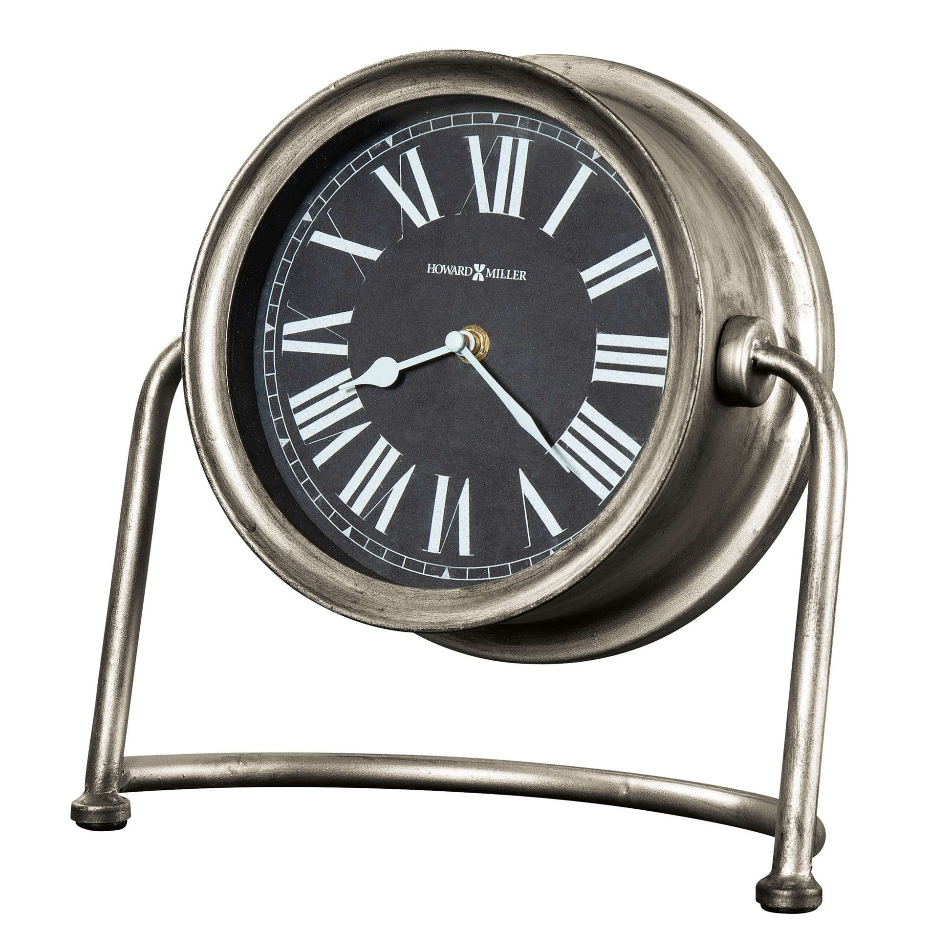 A vintage-style silver alarm clock with Roman numerals and a round face.