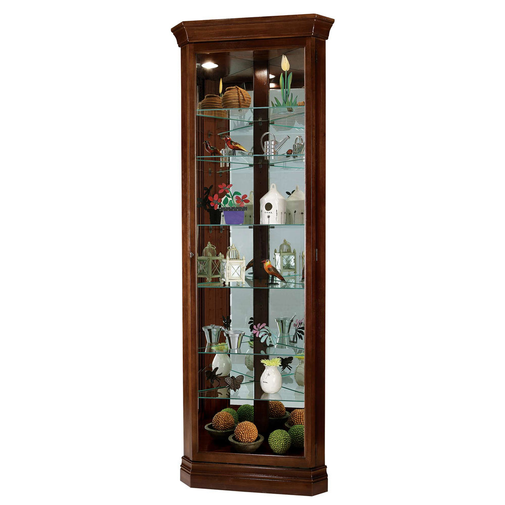Tall wooden display cabinet filled with decorative items.