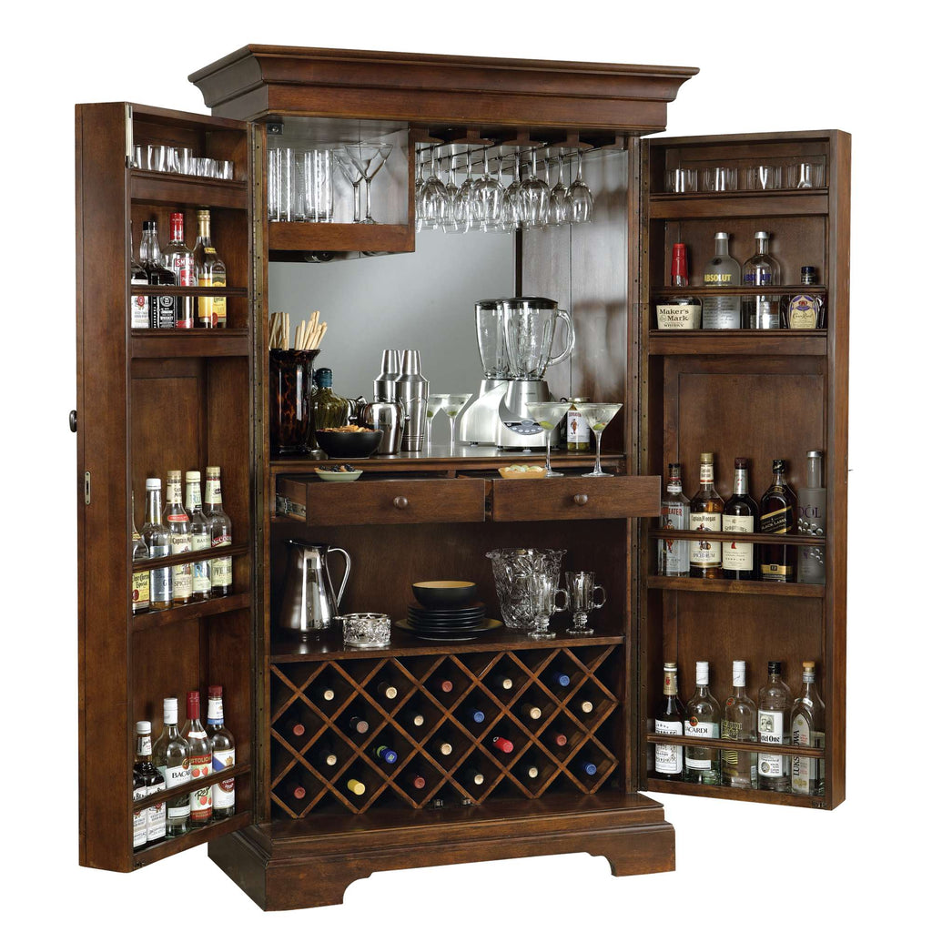 Wooden bar cabinet with two open doors displaying various bottles, glasses, and wine storage.