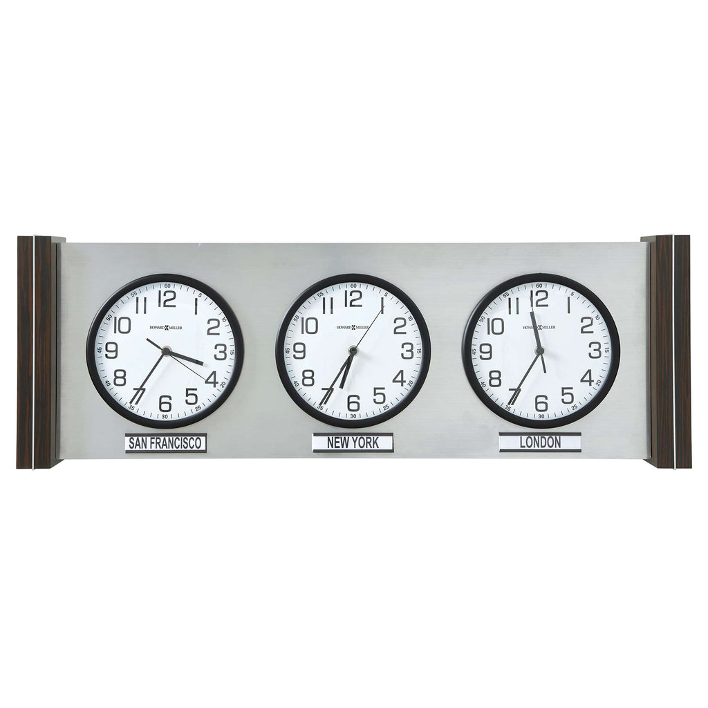 A wall clock displaying three time zones with black frames and white faces.