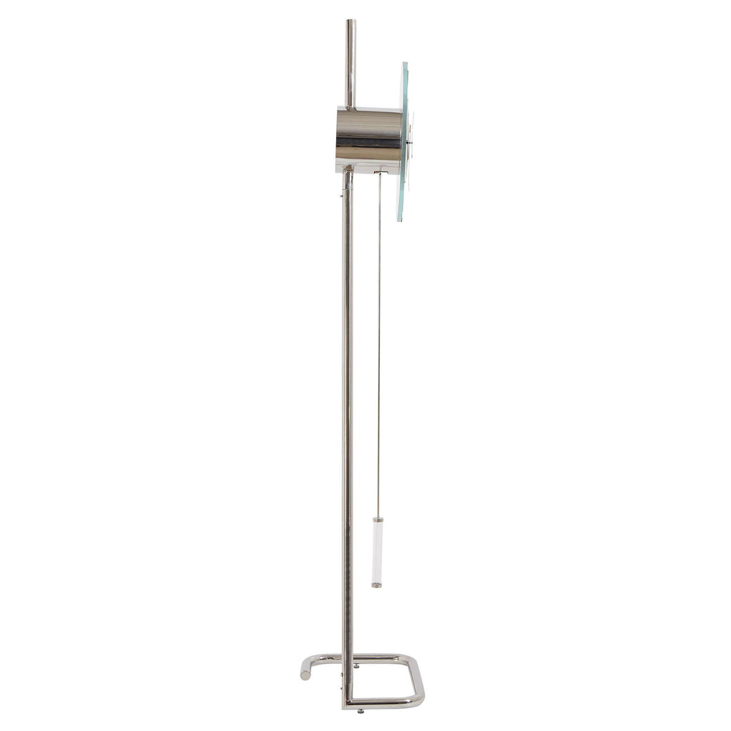 A modern floor lamp with a sleek metal design and a glass shade.