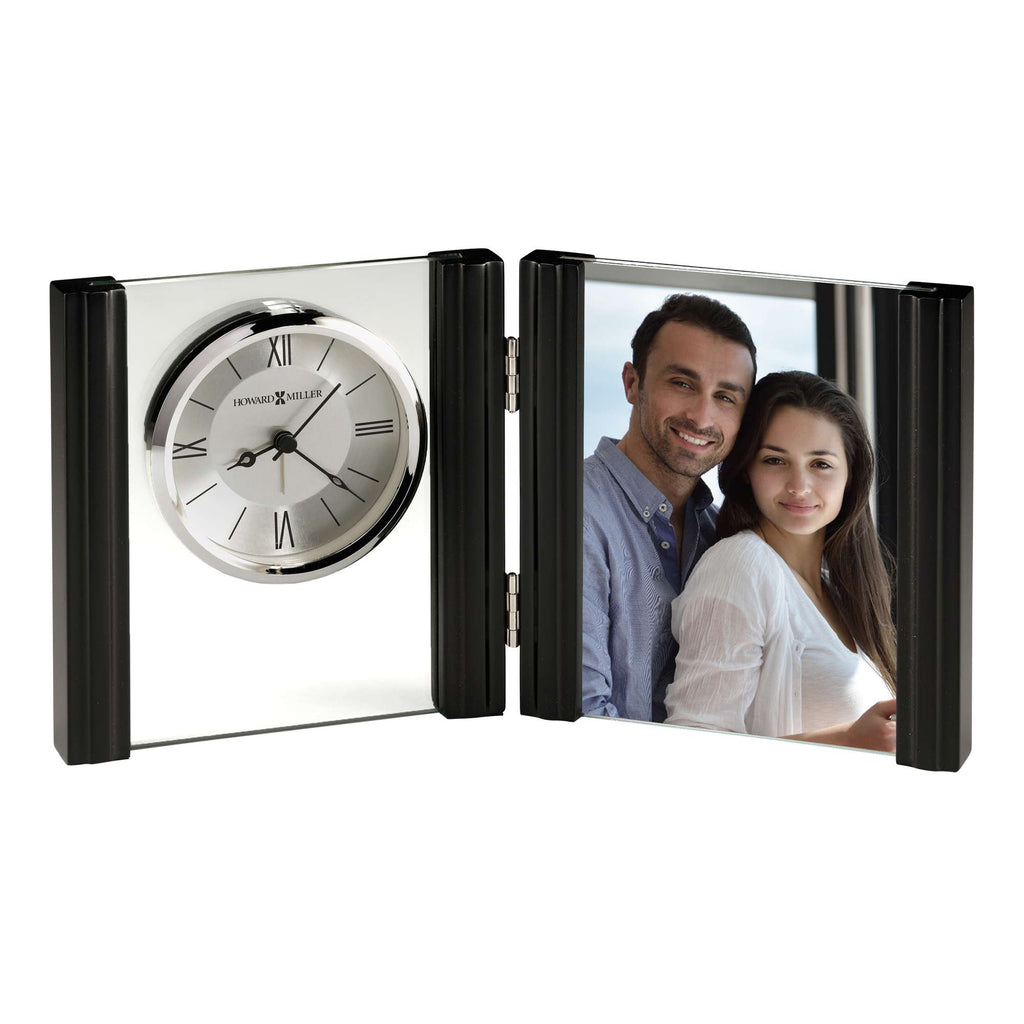 A decorative clock and photo frame combination featuring a couple.