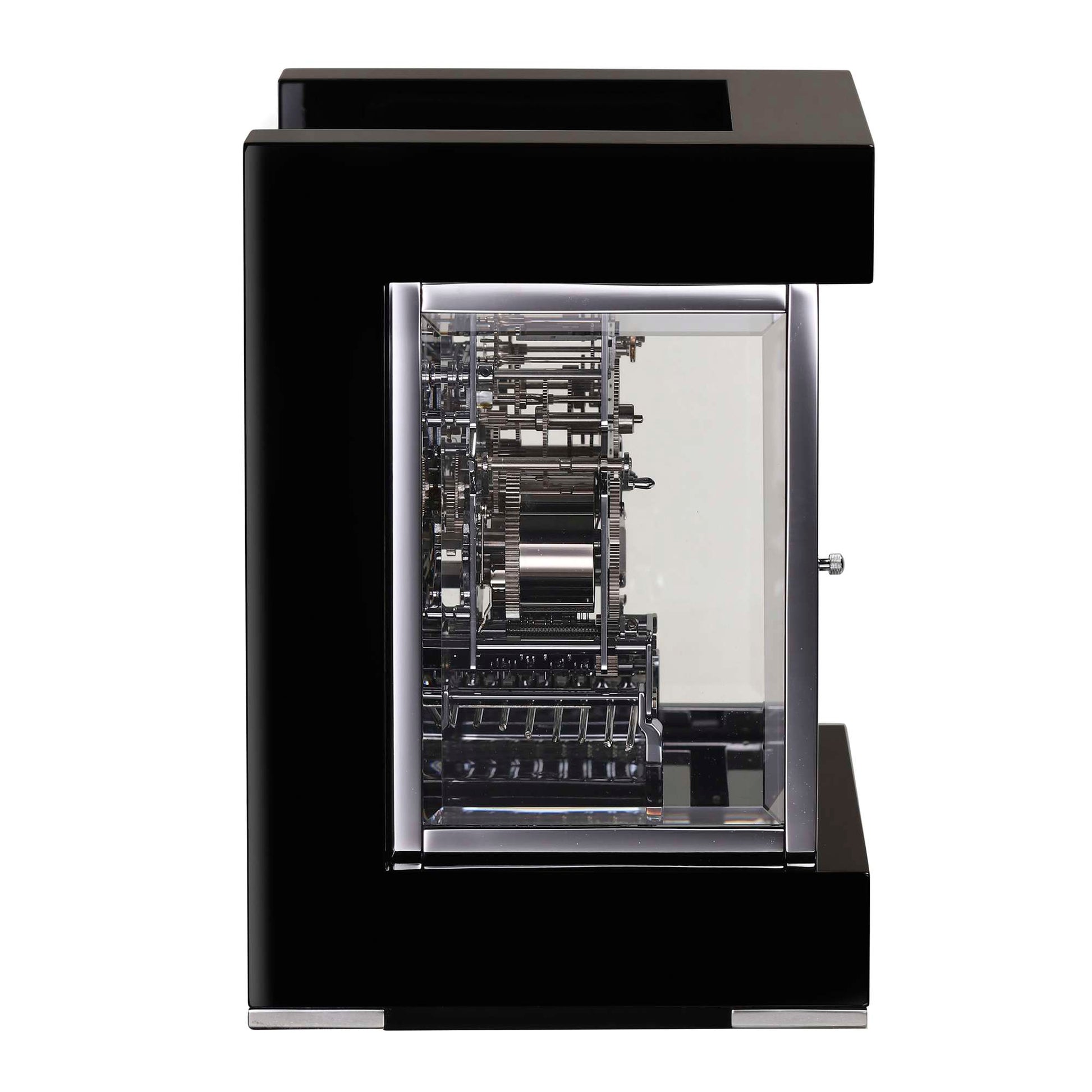 A modern black display case showcasing intricate mechanical components inside.