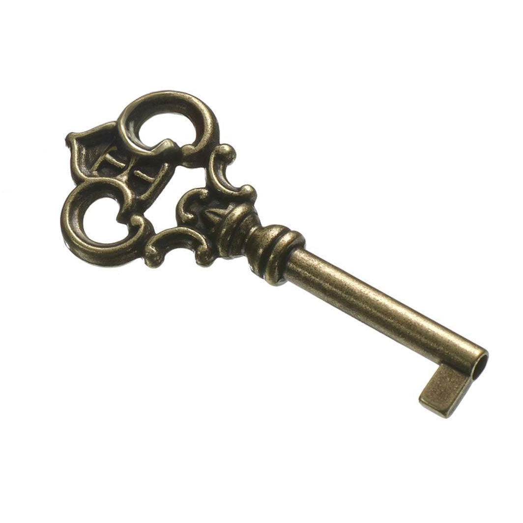 An antique bronze key with an ornate design.