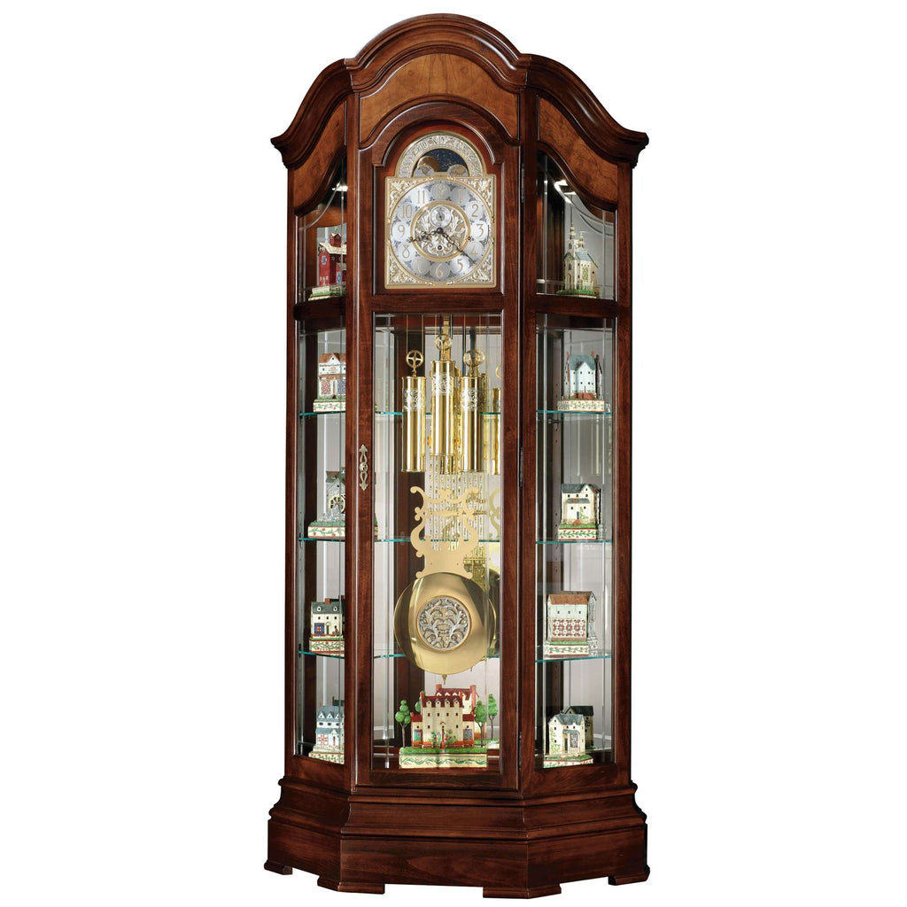 A tall wooden display cabinet showcasing decorative items and a clock.
