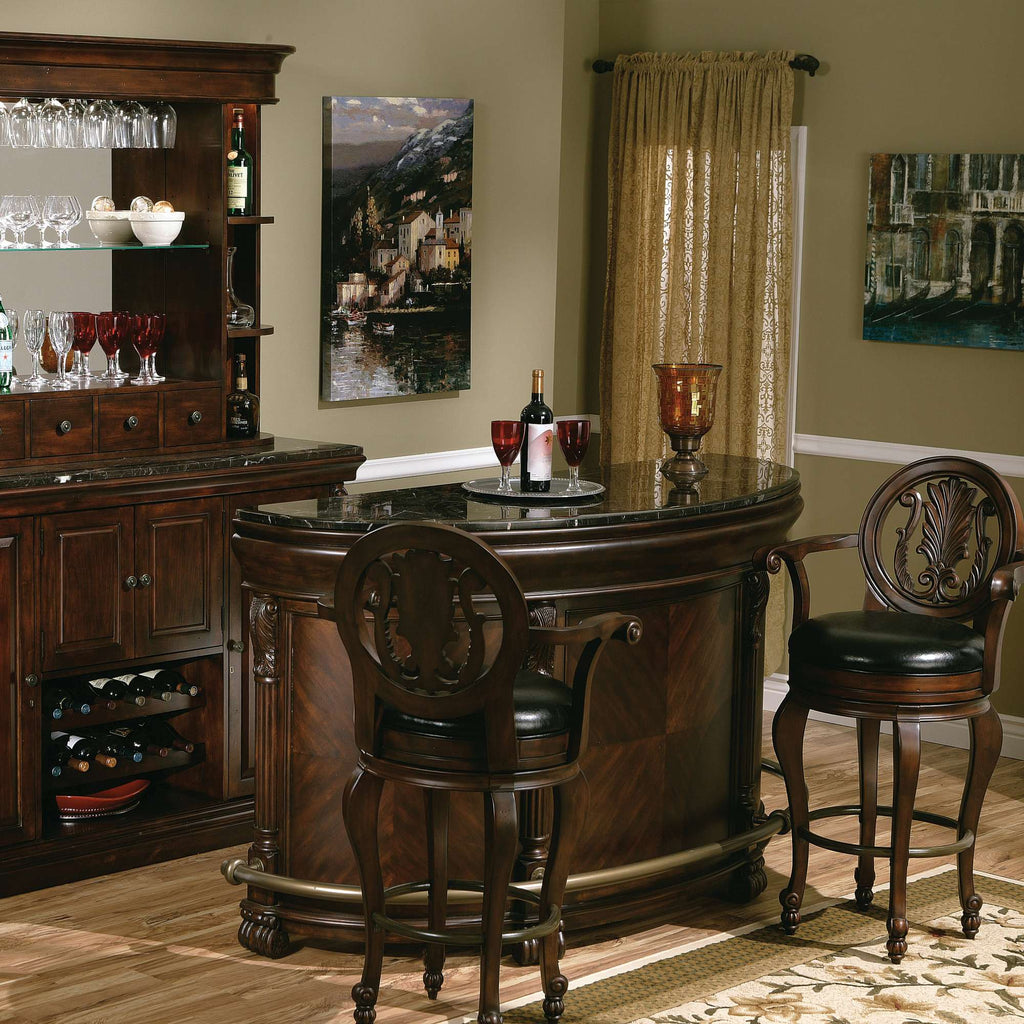 Elegant home bar setup featuring a wooden bar with seating, wine glasses, and decorative items.