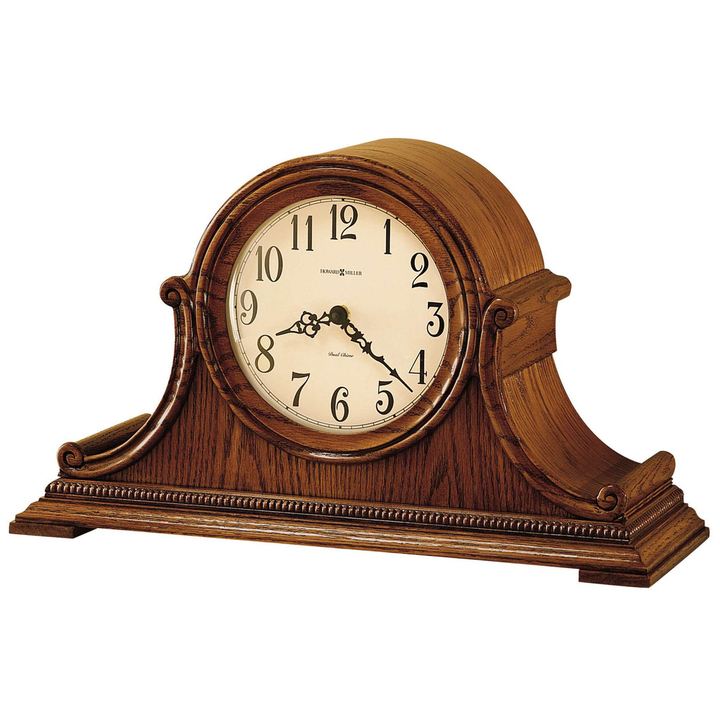 A wooden mantel clock with ornate design and Roman numerals.