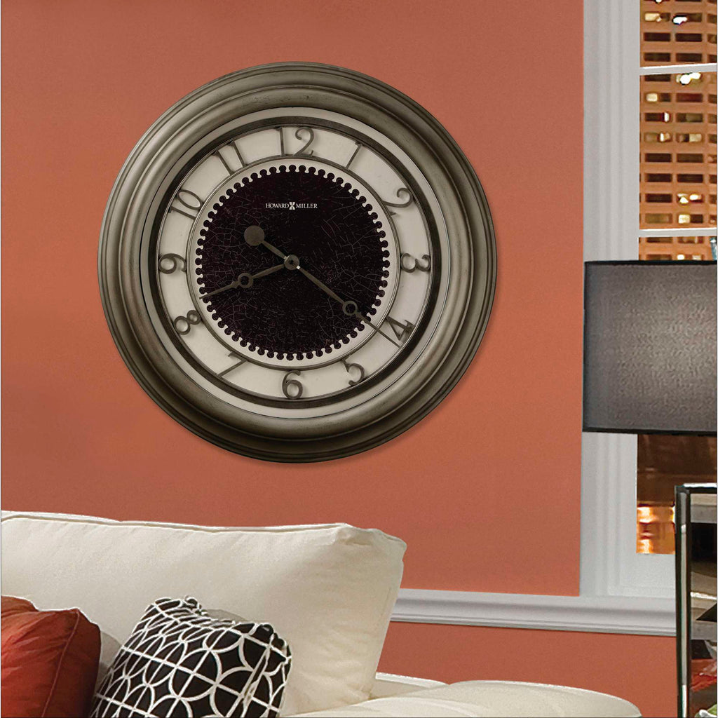 Wall clock with a decorative frame on an orange wall