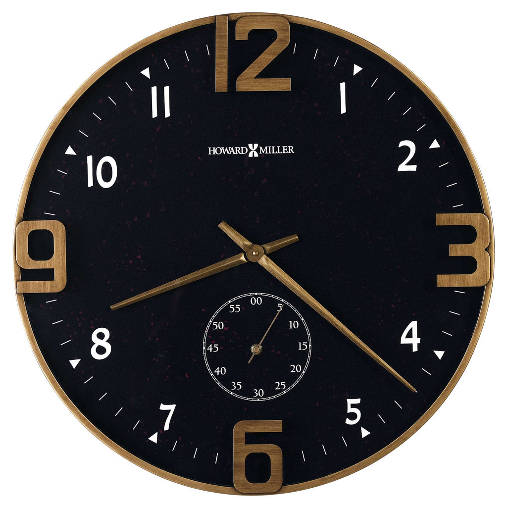 Round black wall clock with gold accents and a smaller clock face