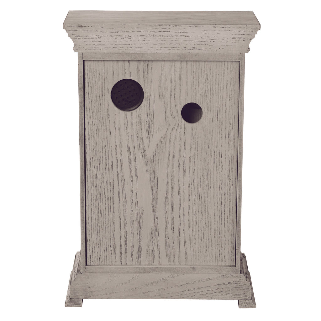 A wooden cabinet with two circular holes on the front.