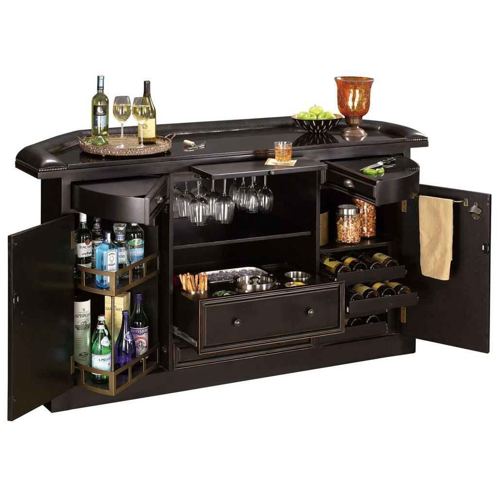 A stylish home bar with drinks, glasses, and storage for utensils.