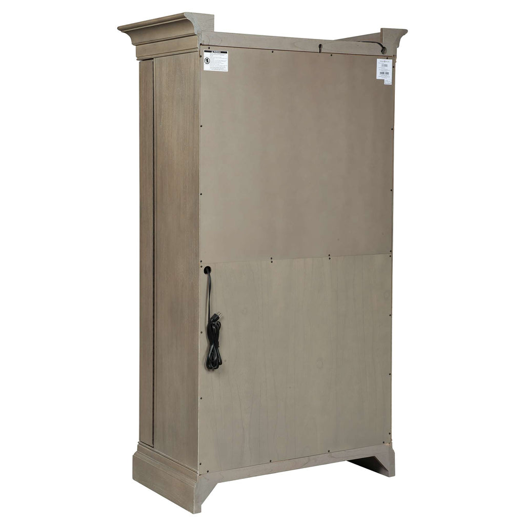 A tall wooden cabinet with a textured surface and decorative top.