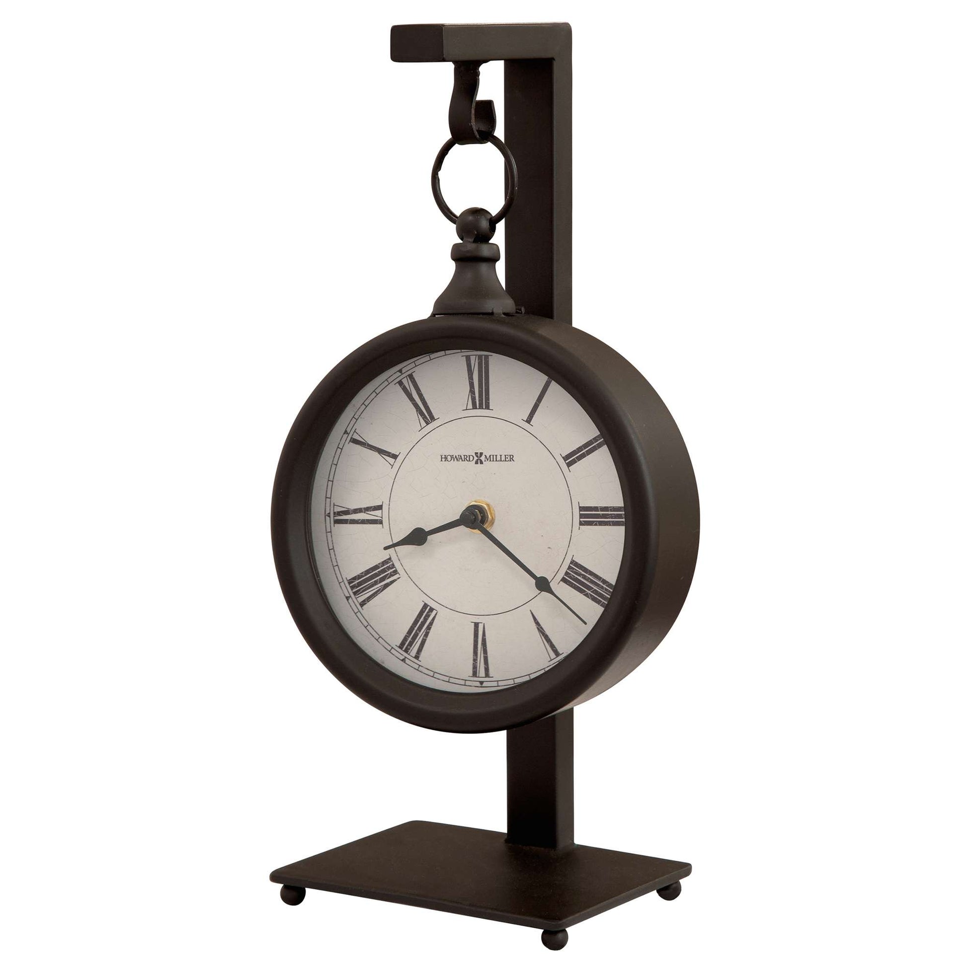 A vintage-style clock with Roman numerals, mounted on a sleek metal stand.