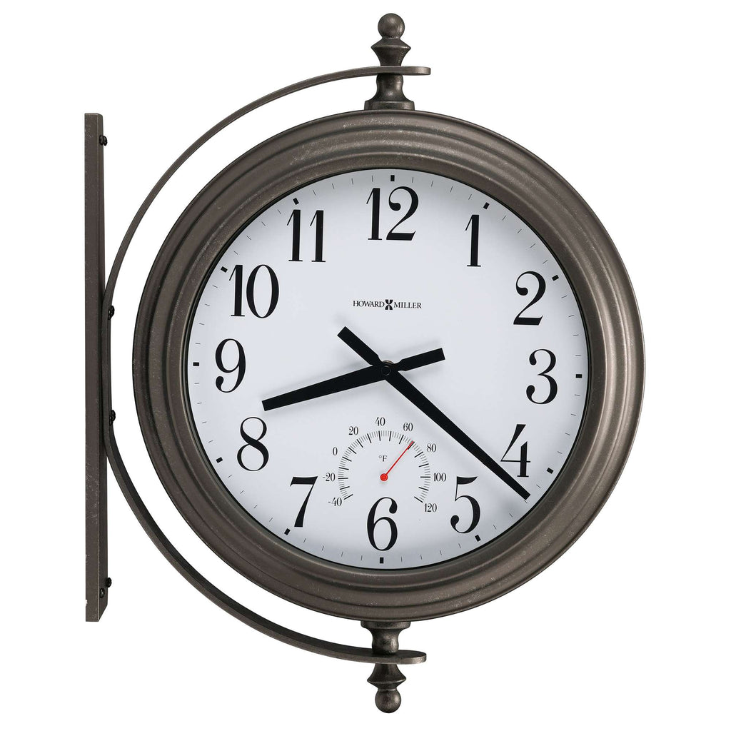 Wall clock with visible hour, minute, and second hands, featuring a thermometer