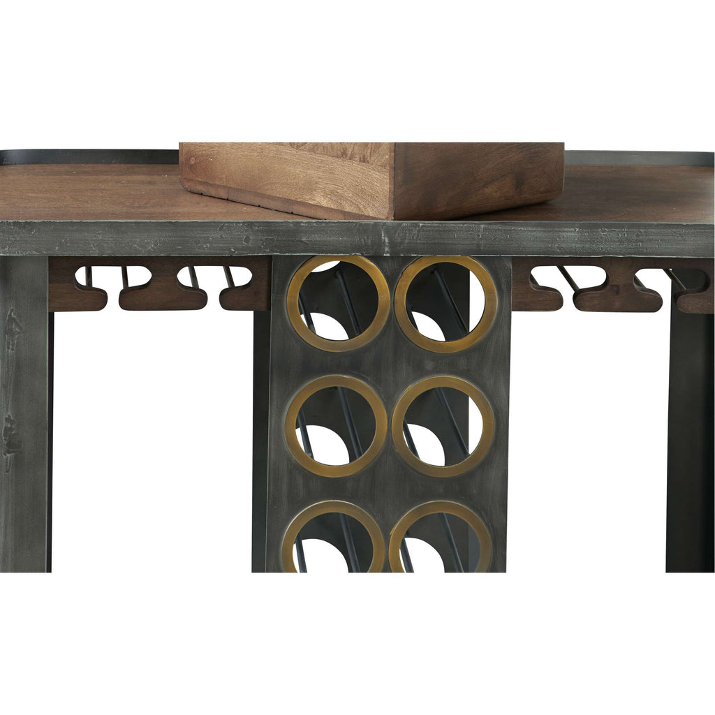 Close-up of a modern table featuring a unique design with circular cutouts and metallic accents.