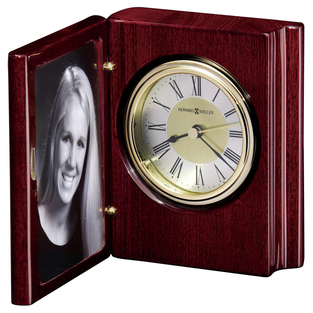 A wooden desk clock with a photo frame on the side.