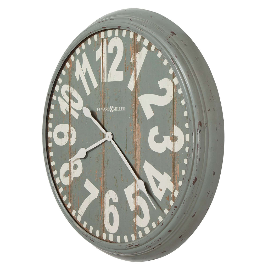 A vintage-style round clock with a distressed gray face and large white numbers.