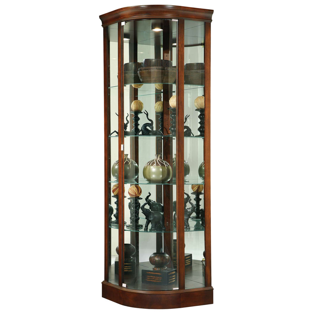A tall, curved display cabinet with glass shelves showcasing various decorative items and sculptures.