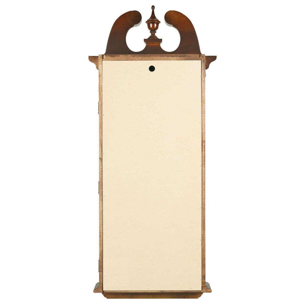 A tall, vintage-style clock with a decorative top, featuring a blank face.