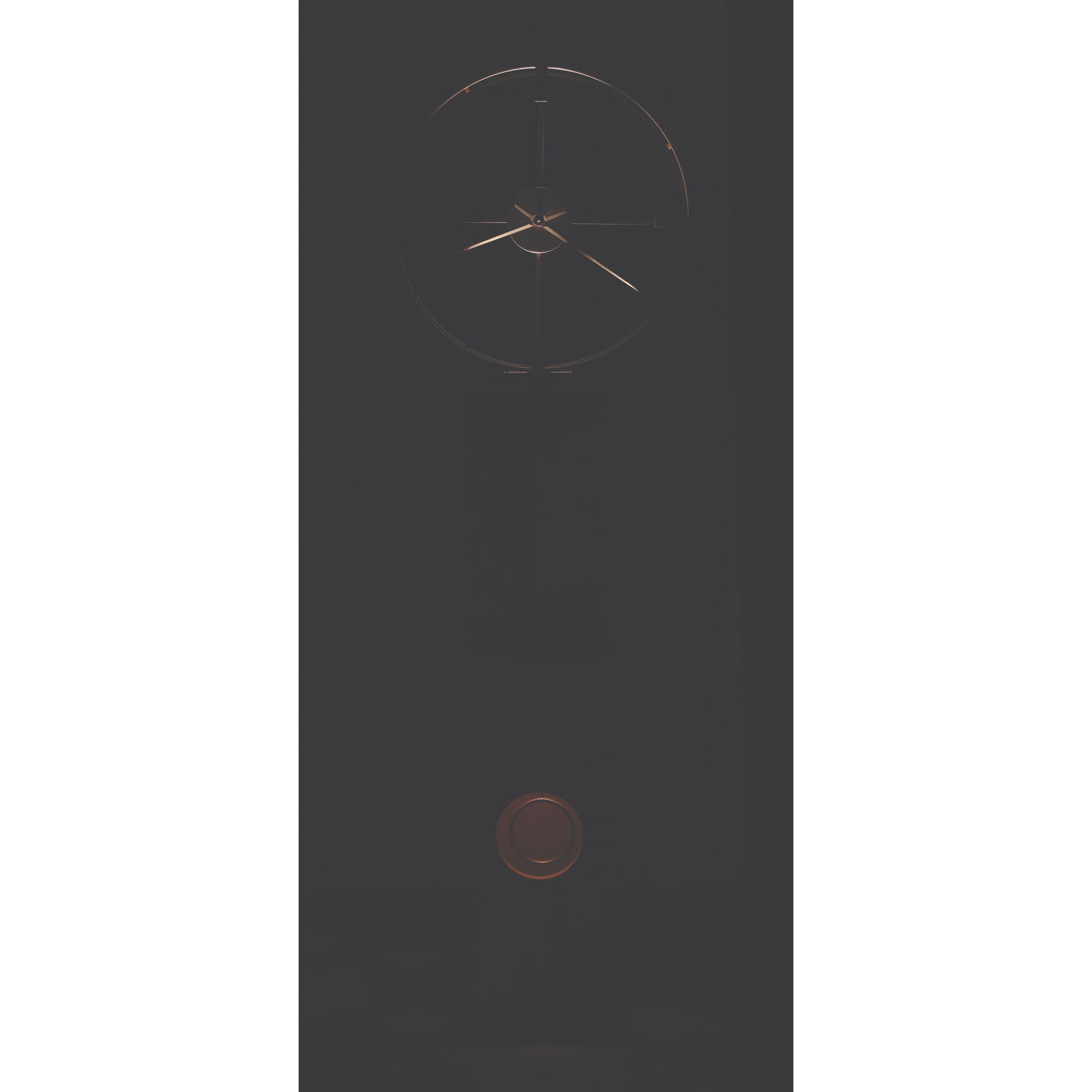 Minimalist wall clock with geometric design and a dark background