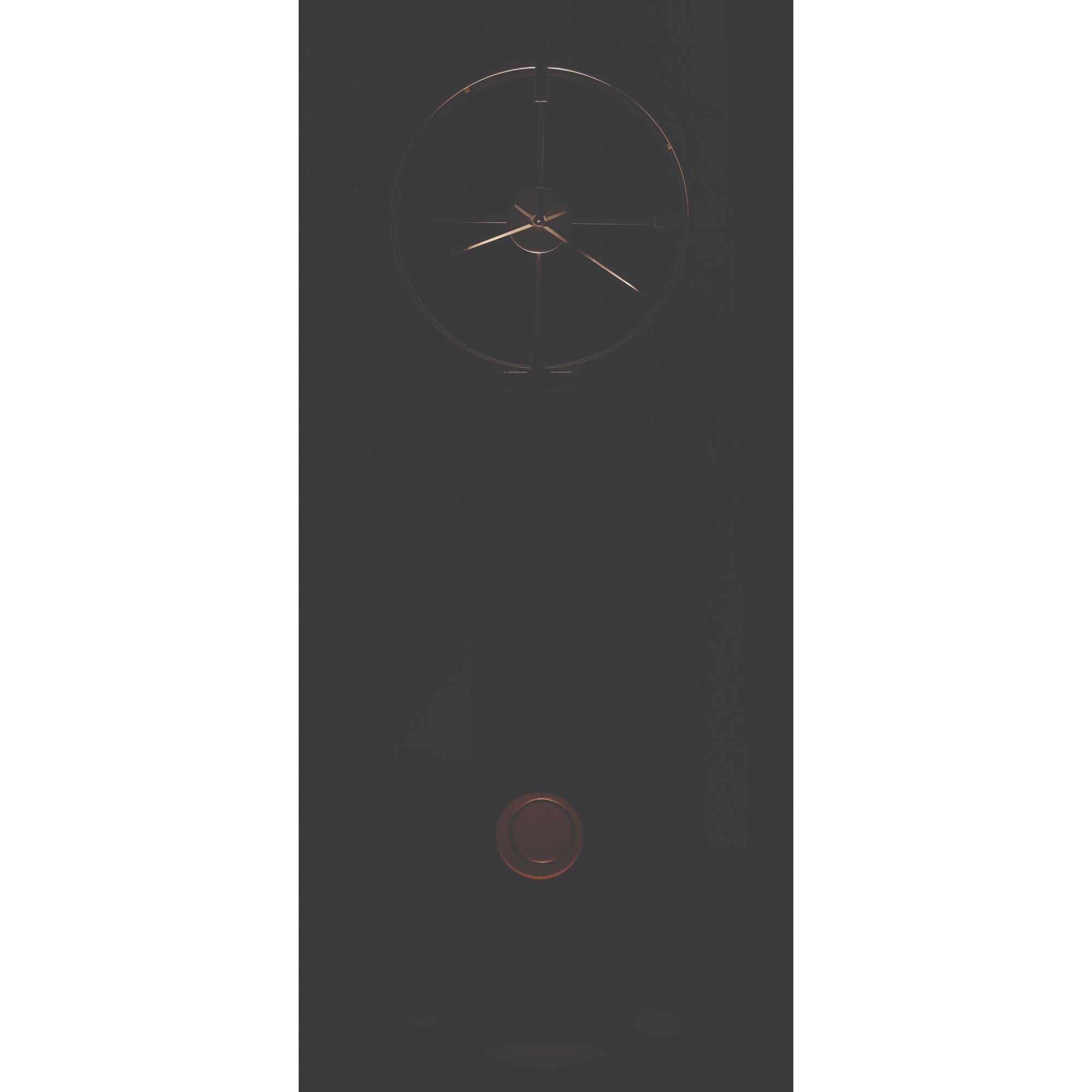 Minimalist wall clock with geometric design and a dark background