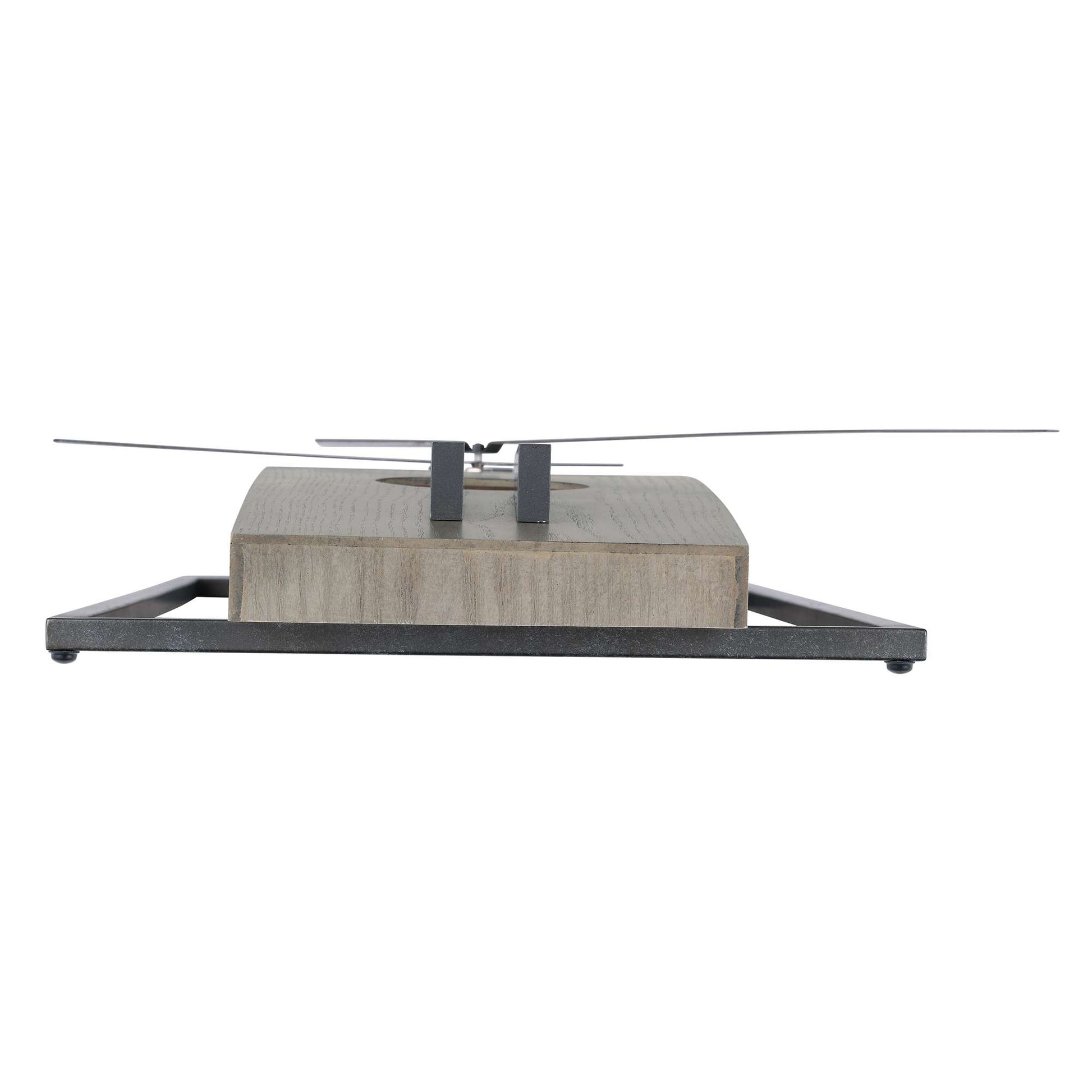 A modern decorative object featuring a rectangular block with a metal base and a slender metal arm.