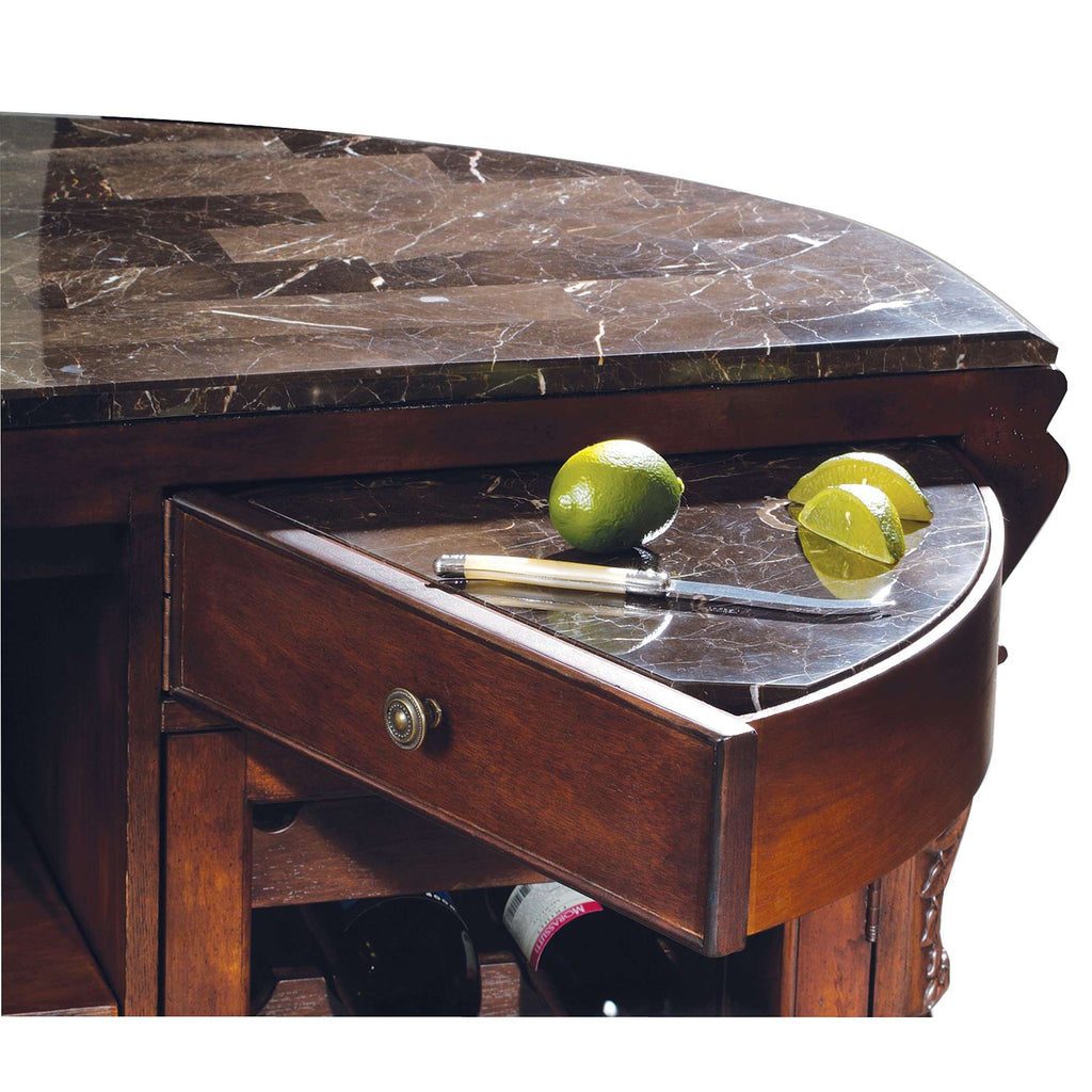 Wooden bar with marble top and a drawer containing two limes and a pen.