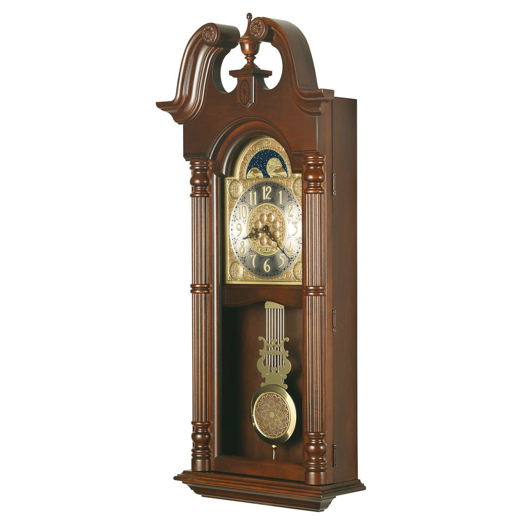 A decorative wooden wall clock with a classic design featuring a gold clock face and pendulum.