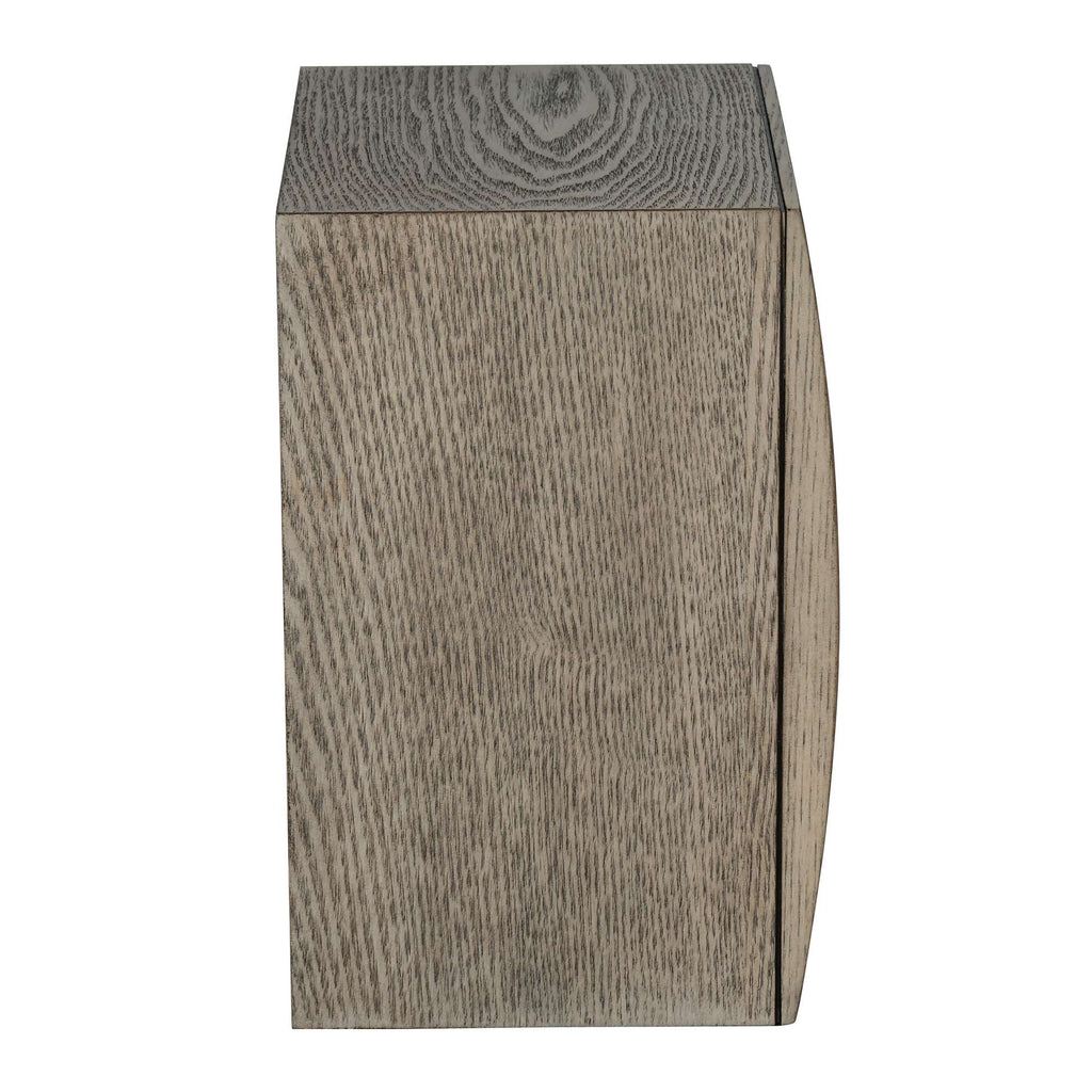 A wooden block with a textured surface and a curved edge.