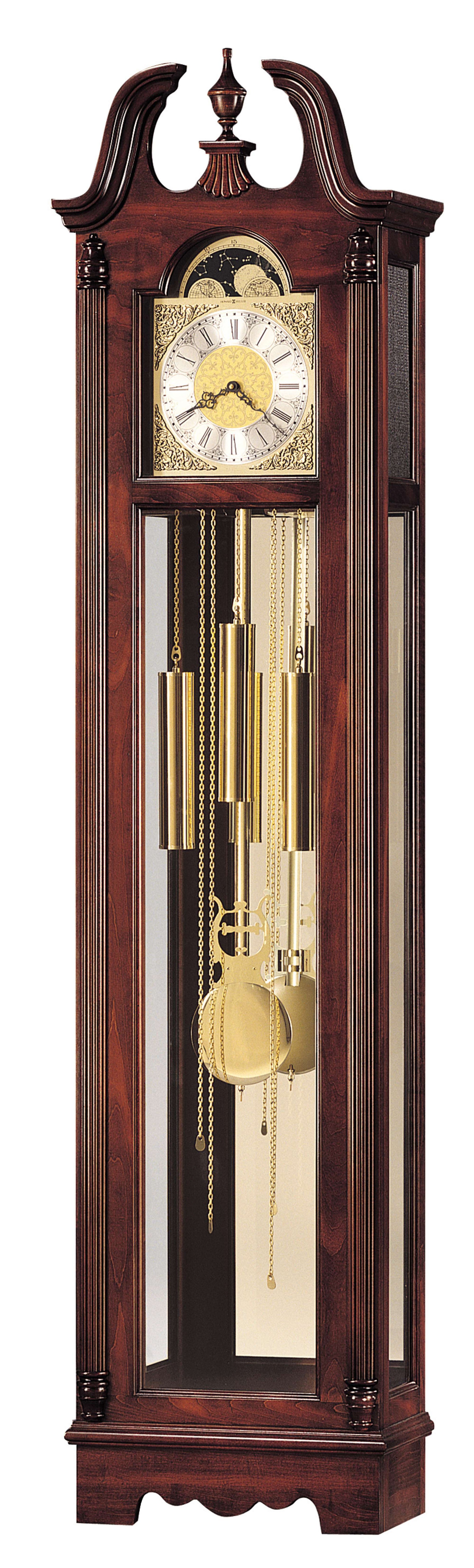 A traditional wooden grandfather clock with a glass front, featuring gold pendulums and a decorative clock face.