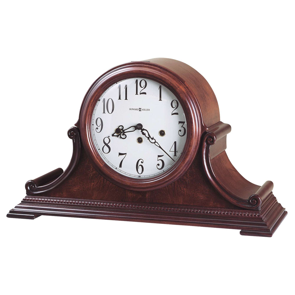 Classic wooden mantel clock with a round face and decorative base