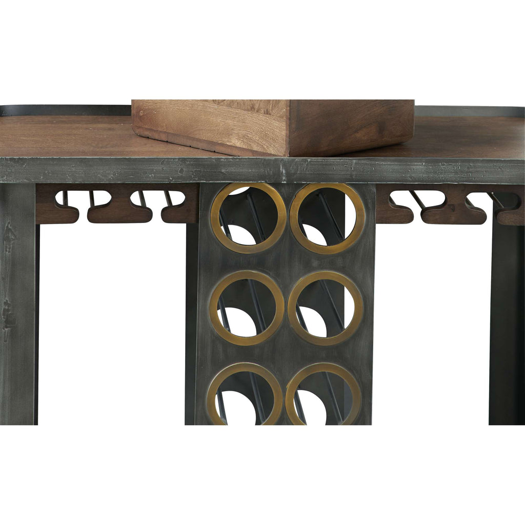 A unique table with a wooden top and a metal base featuring circular cutouts.